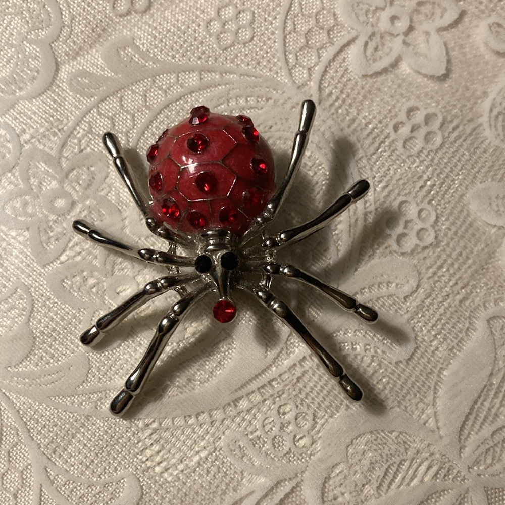 Red st spider pin, blk cord w/wooden totem $14